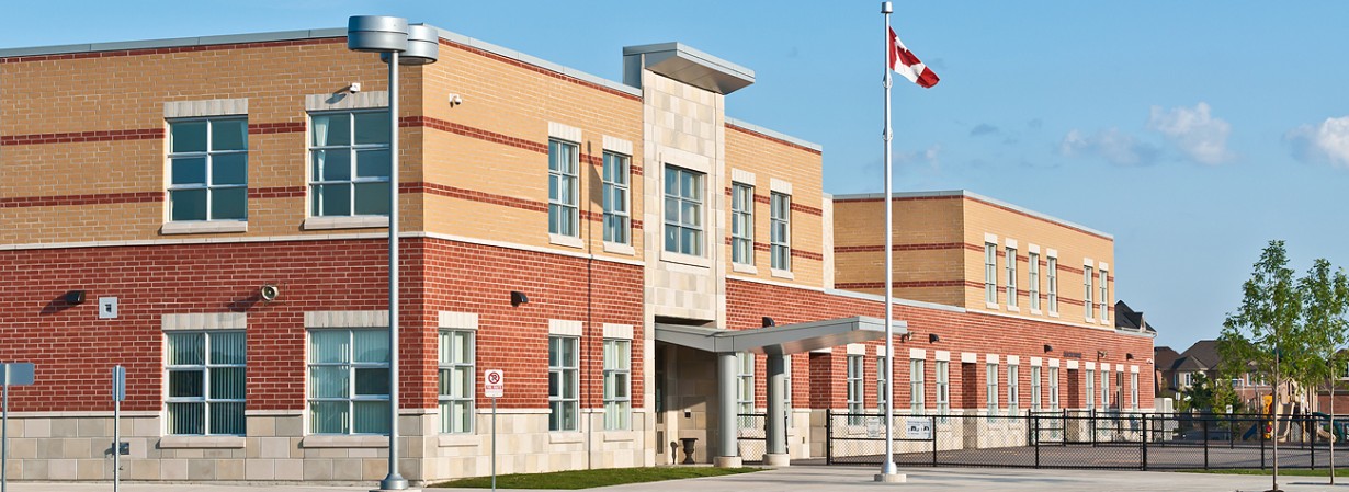 The flag of Canada in front of a building